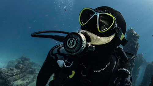 Underwater diver in SCUBAPRO gear exploring