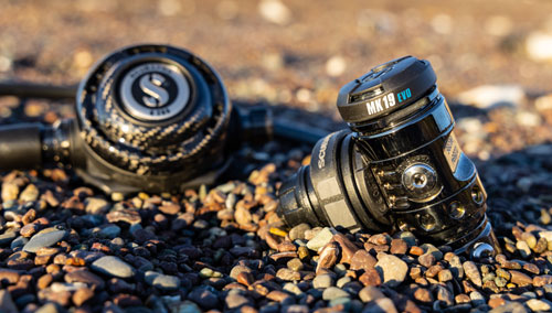 MK19 Evo/G260 Carbon Black Tech Dive Regulator System on the rocky beach