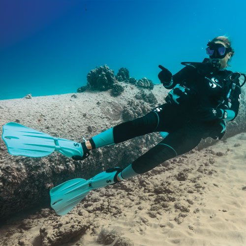 Diver swimming along the ocean floor in SCUBAPRO gear