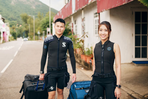 Man and woman wearing SCUBAPRO Hybrid Cargo Shorts