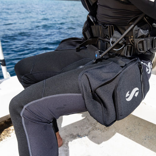 Close up of a man sitting wearing SCUBAPRO Hybrid Cargo Pants