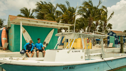 Men in SCUBAPRO divewear sitting on a dock