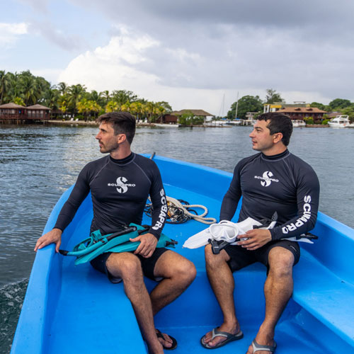 Two men wearing black SCUBAPRO UPF 50 rashguards