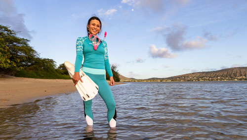 Woman snorkeler wearing SCUBAPRO T-Flex rash guard and leggings