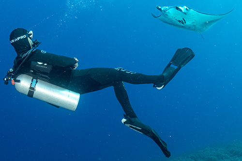 Scuba Diver wearing Everflex Arch boots made of X-foam ilimestone-based neoprene