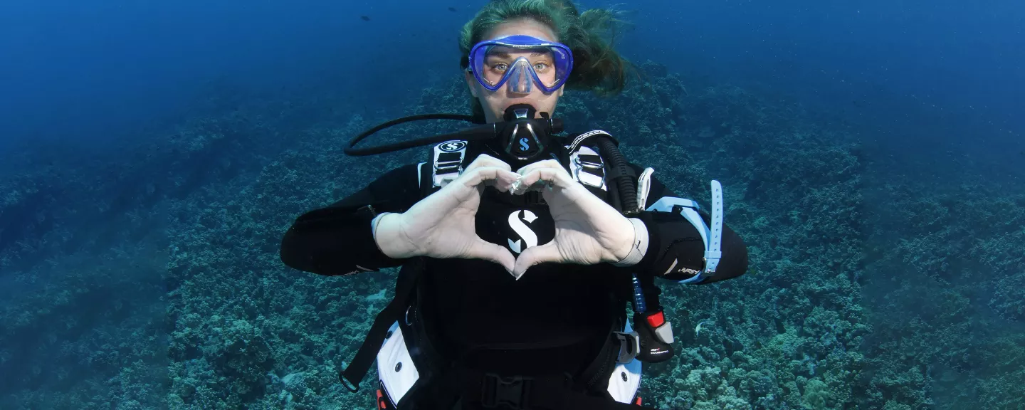 diver shows heart symbol