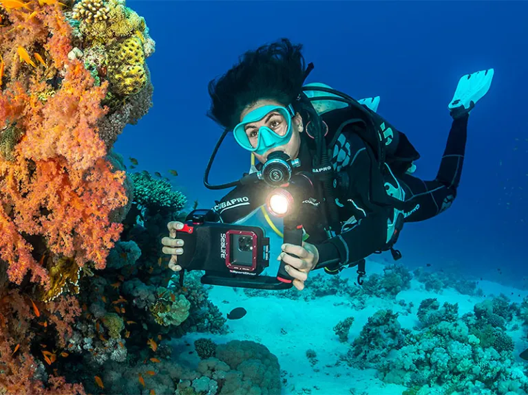 scuba diver exploring a coral reef with SeaLife SportDiver